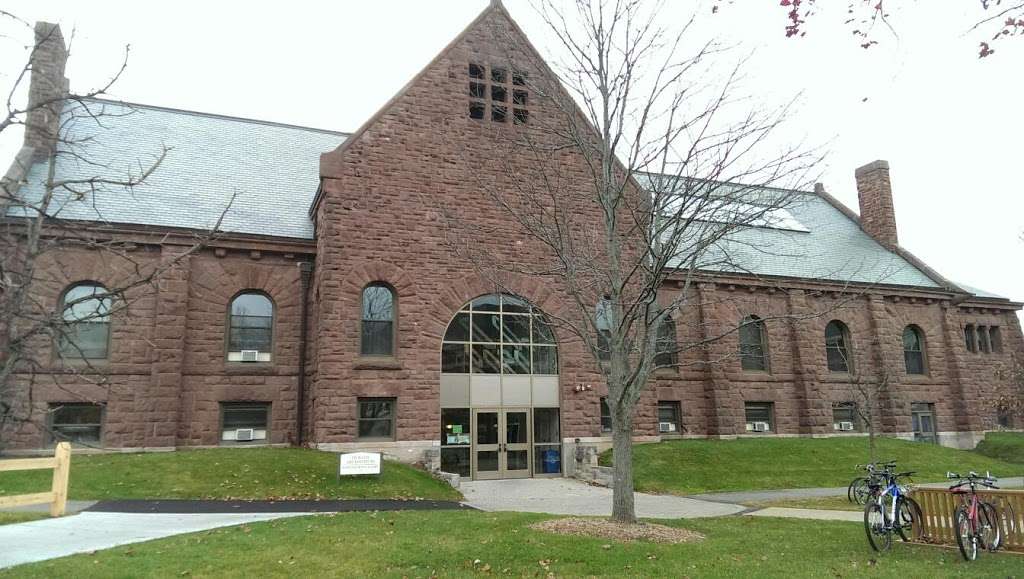 A large brick building with bikes parked in front of it