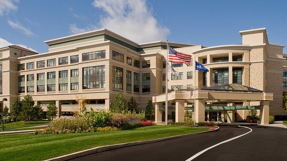 A large building with an american flag on top of it
