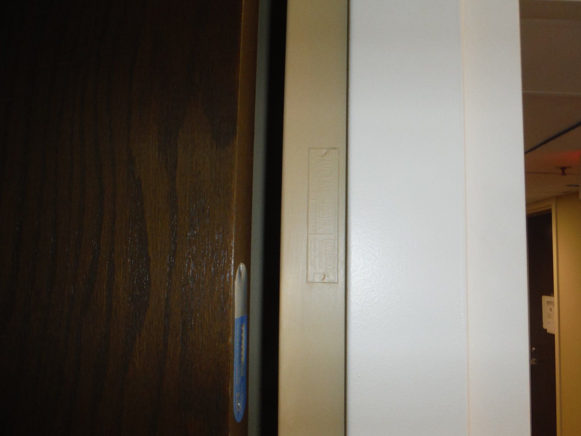 A close up of a door with a white frame