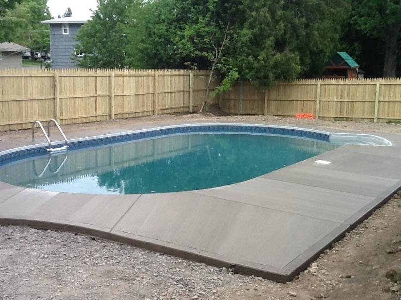 Pool With Wooden Fence — Liverpool, NY — CoolWaters Pool & Spa