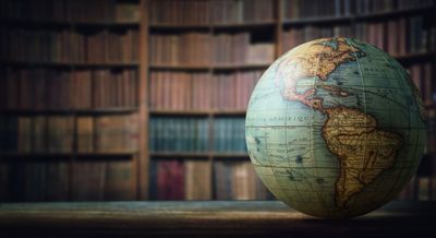 Globe On Bookshelf Background — Orlando, FL — Priority One Globe On Bookshelf Background — Orlando, FL — Priority One