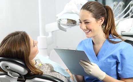 Bridges — Woman Taking to the Dentist in Redding, CA Bridges — Woman Taking to the Dentist in Redding, CA