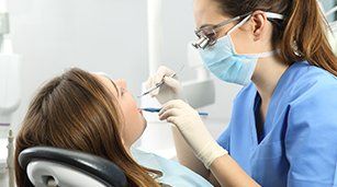 Root Canals — Dentist Checking the Teeth in Redding, CA Root Canals — Dentist Checking the Teeth in Redding, CA