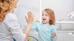 Cosmetic Dental Bonding — Child Goofing Around the Dentist in Redding, CA Cosmetic Dental Bonding — Child Goofing Around the Dentist in Redding, CA