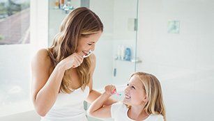 Sedation Dentistry — Brushing Teeth Together in Redding, CA Sedation Dentistry — Brushing Teeth Together in Redding, CA