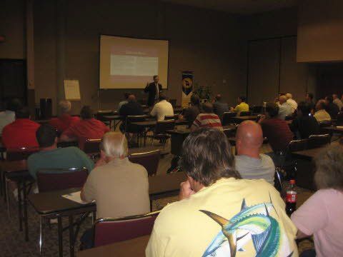A man is giving a presentation to a group of people