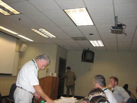 A man is giving a presentation to a group of people
