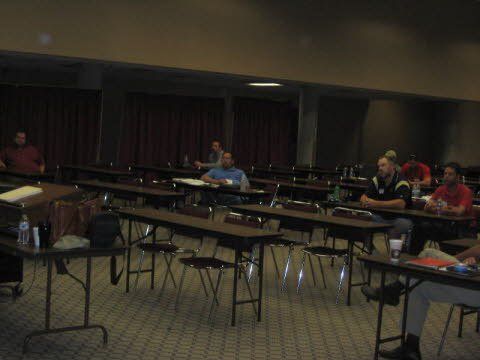 A group of people are sitting at tables in a room