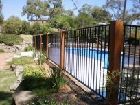 people in pool with fence