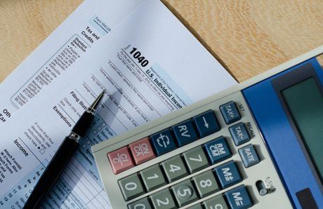 pen and calculator on papers