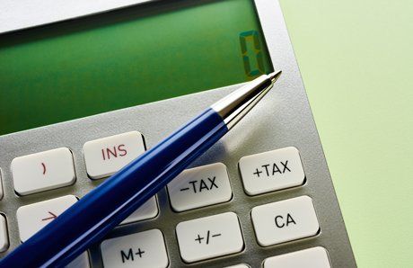 blue metal pen on calculator