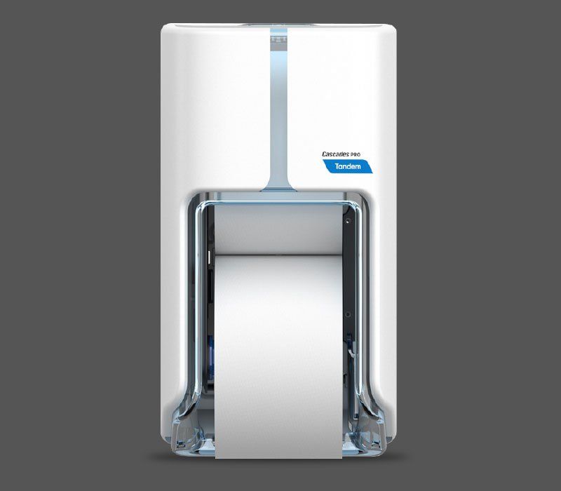 A white machine with a roll of paper coming out of it
