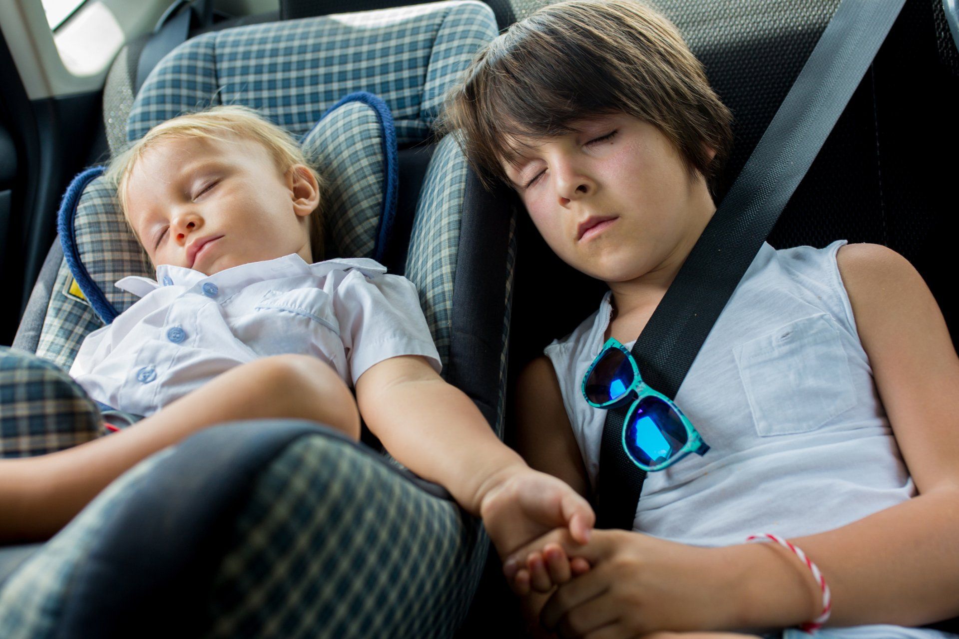 Children Sleeping In Car Seats While Traveling — Denver, CO — Mr. Sids Fine Auto Upholstery