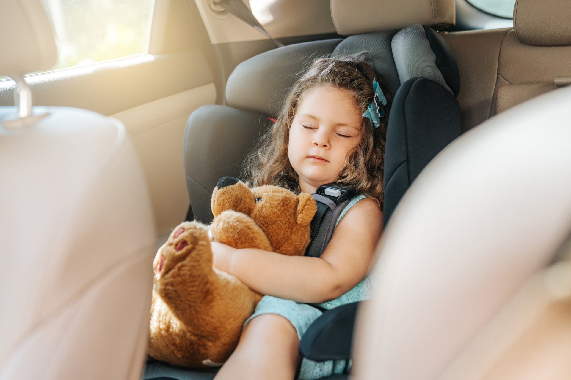 Cute Little Baby Child Sitting In Car Seat — Denver, CO — Mr. Sids Fine Auto Upholstery Cute Little Baby Child Sitting In Car Seat — Denver, CO — Mr. Sids Fine Auto Upholstery