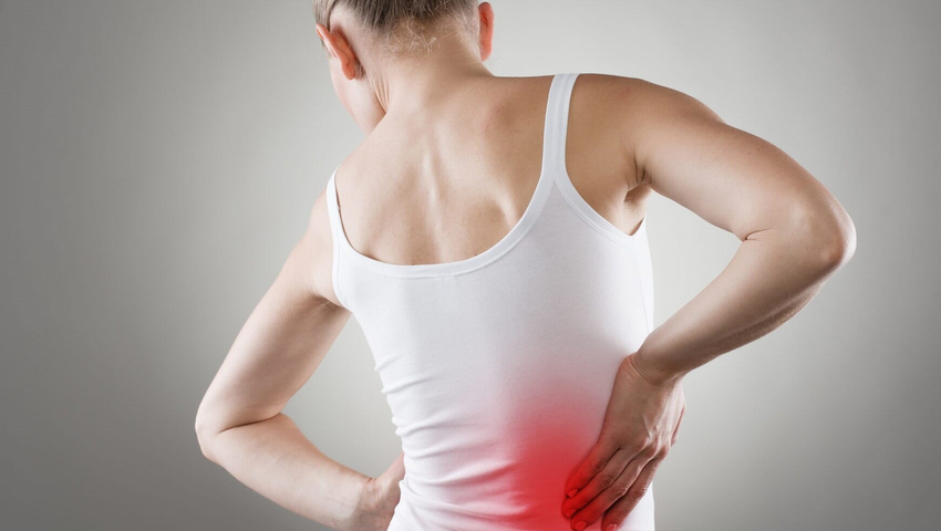 Woman with back pain — Nutrition in White River Junction, VT Woman with back pain — Nutrition in White River Junction, VT
