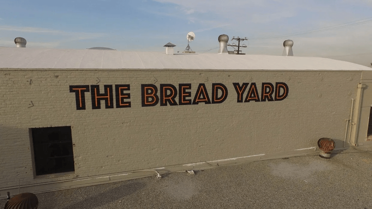 The bread yard is written on the side of a building