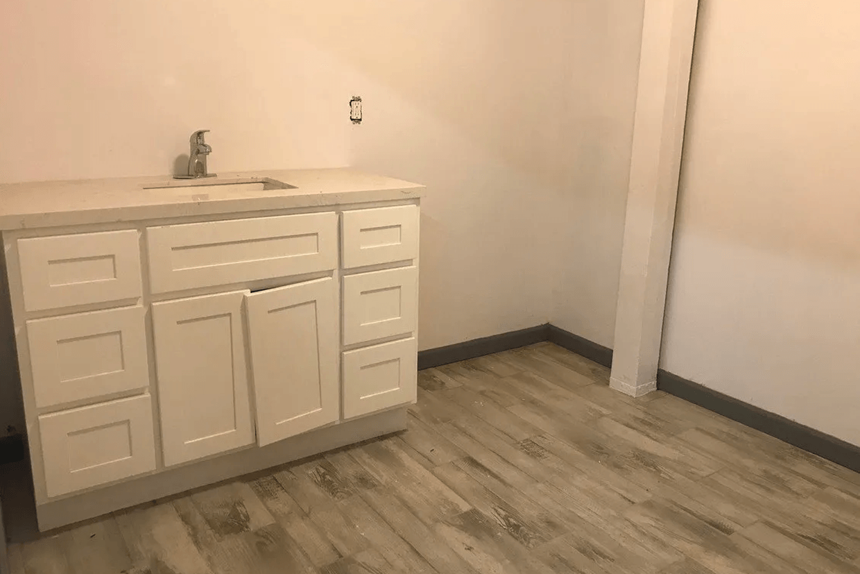 There is a sink in the middle of the room.