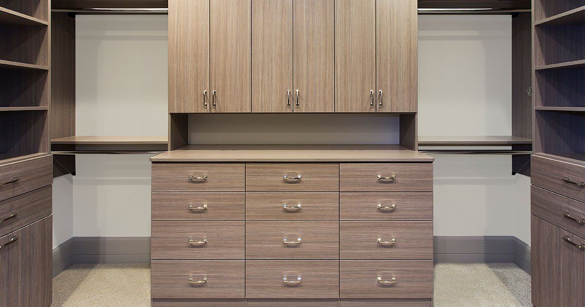 Medium Color Wood Walk In Custom Closet System