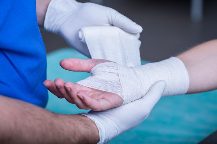 Doctor treating sprained wrist