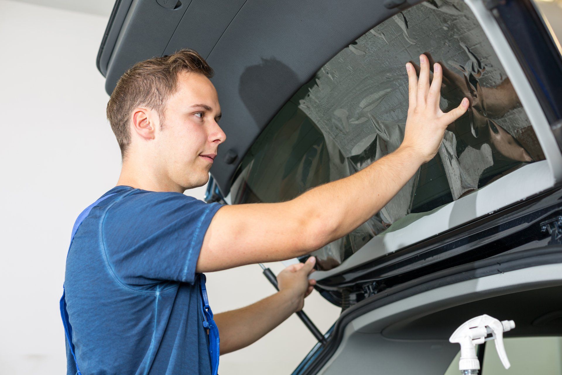 Car Window Tinting — Vehicle Window With a Tinted Foil in Philadelphia, PA