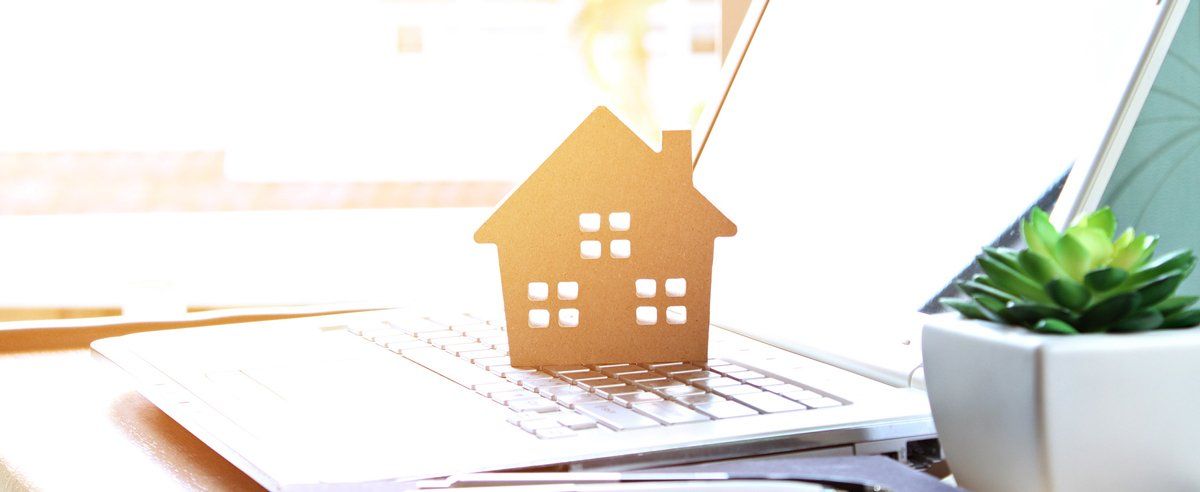 cardboard house on laptop