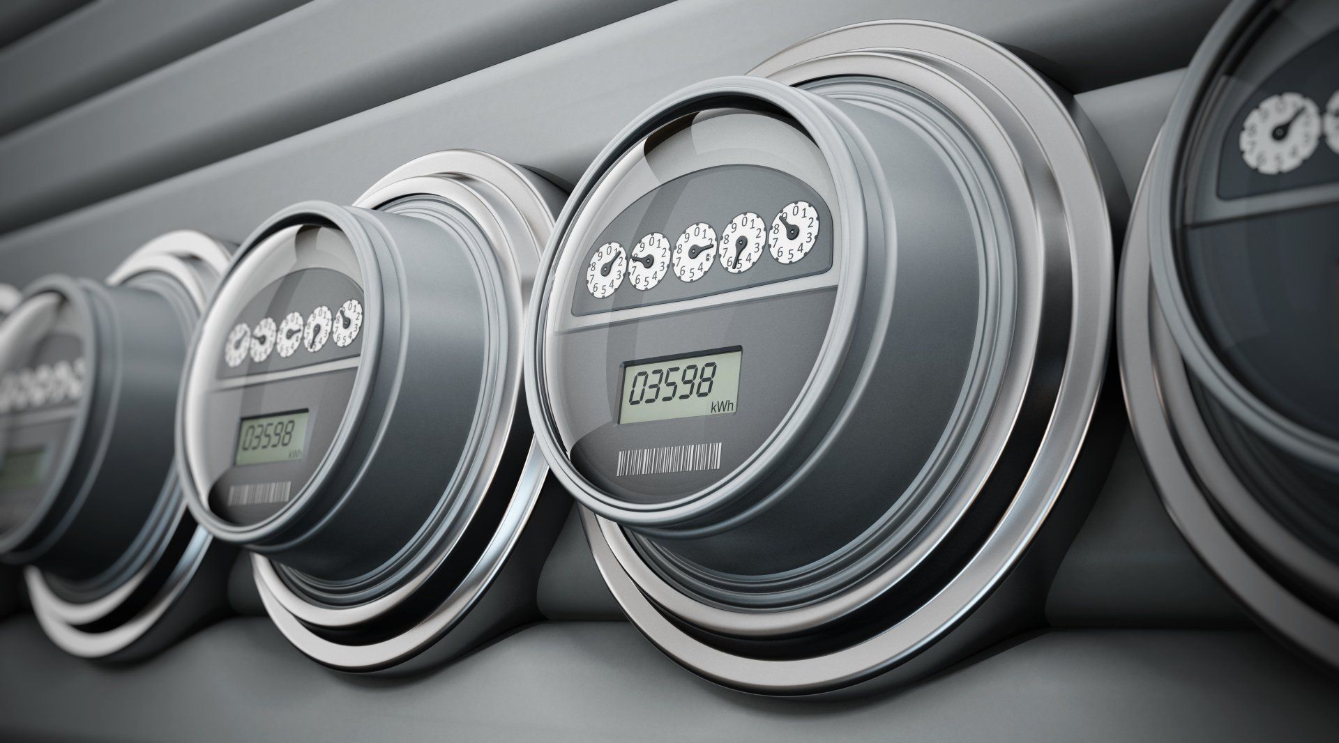 A row of electrical meters are lined up on a wall