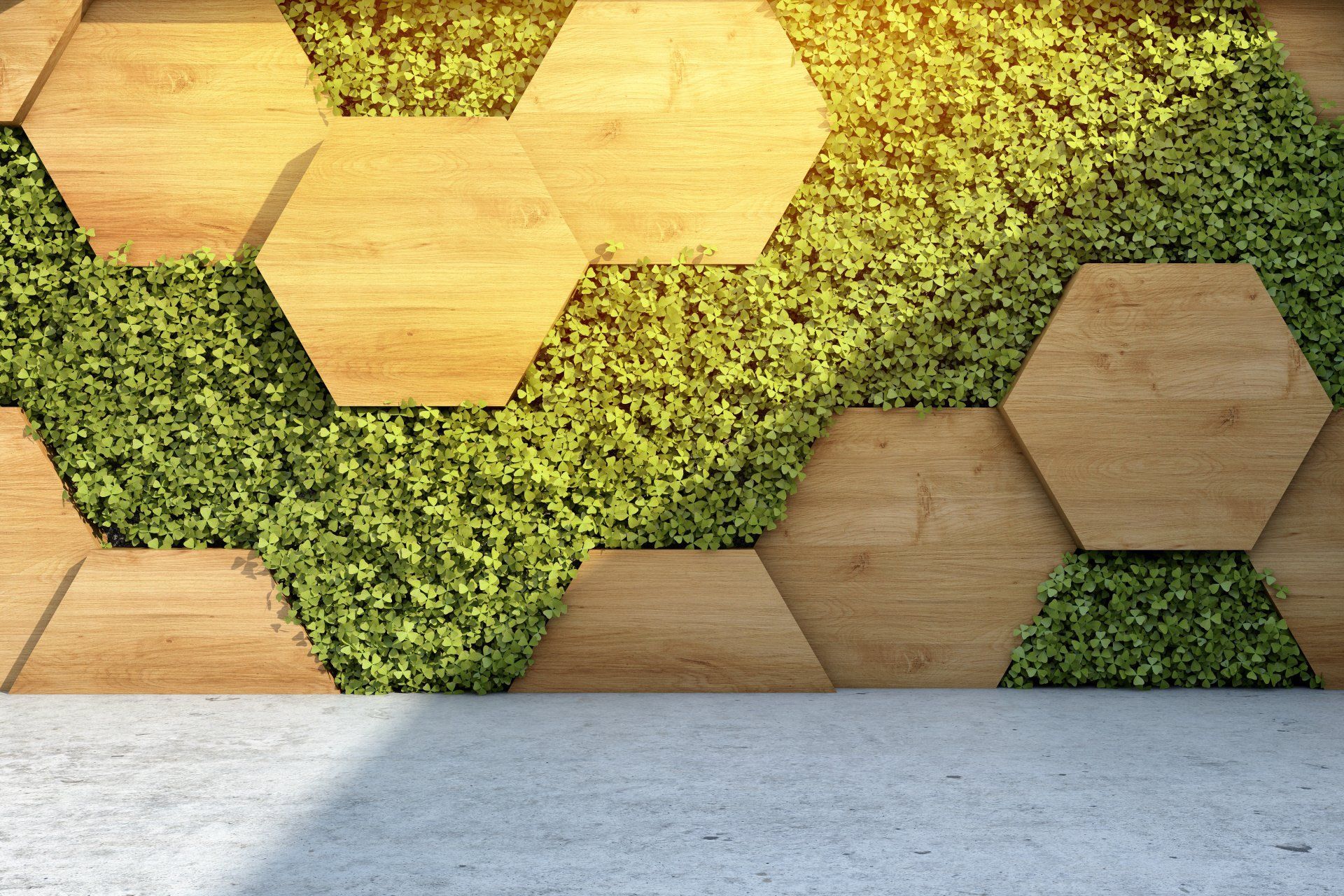 A wooden wall with green plants on it and a concrete floor.