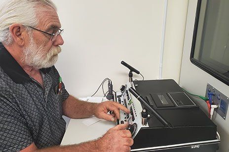 Hearing Specialist – Man Checking the Hearing Equipments in Farmville, VA