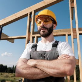 Roofer Standing on A Wooden Roof Frame — Colorado Springs, CO — McWilliams Roofing