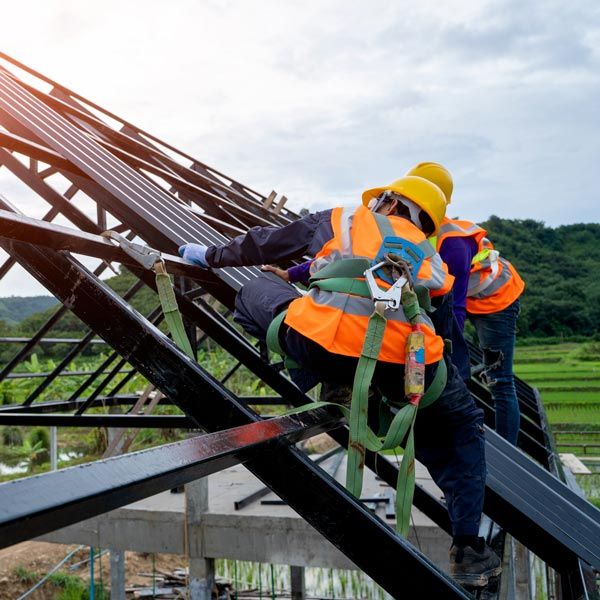 Roofers Working on A Roof Frame — Colorado Springs, CO — McWilliams Roofing