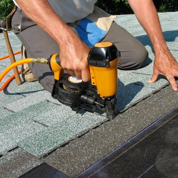 Man Installing Slates on Roof — Colorado Springs, CO — McWilliams Roofing