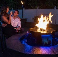 Latest Fireplace — Man and Woman Beside a Fireplace in Poughkeepsie, NY