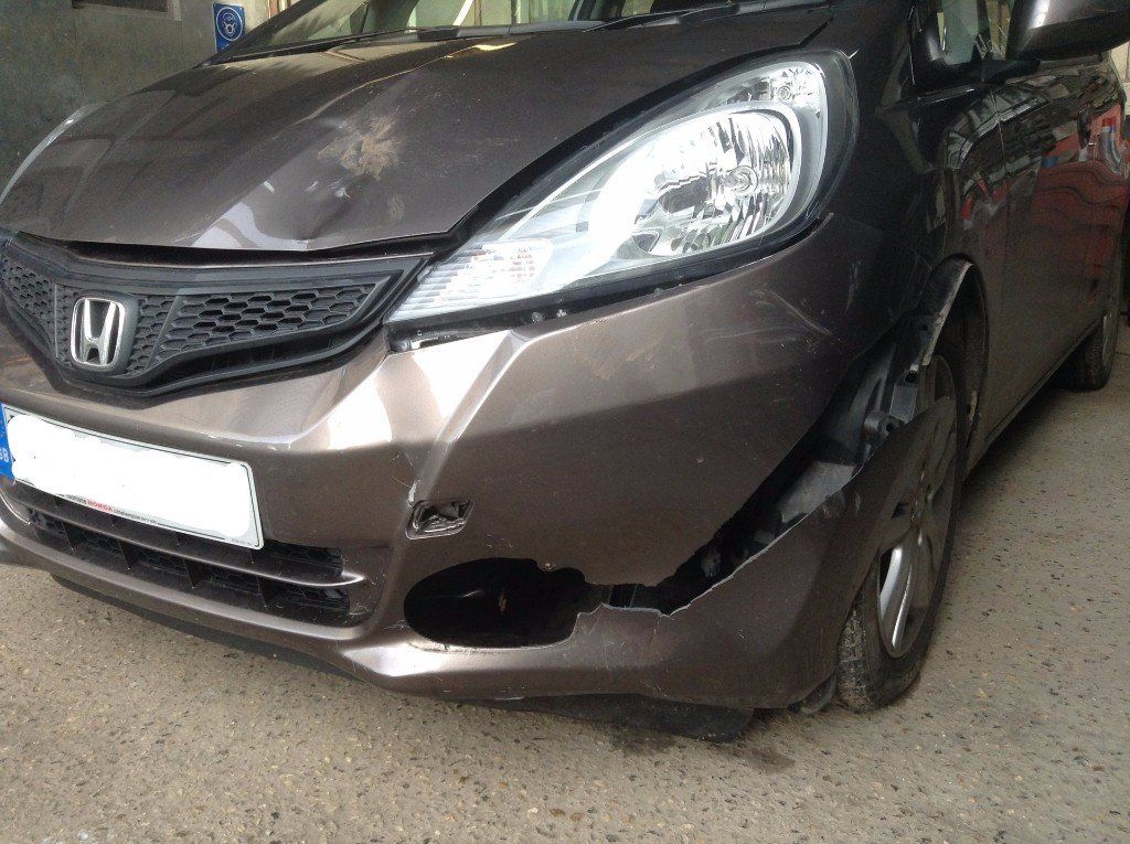Car with damaged bonnet - before