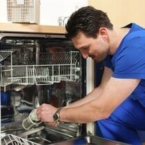Technician_Repairing_Microwave_Oven