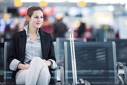 a lady waiting at the airport