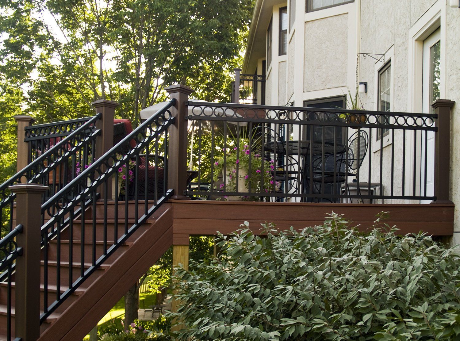 A wooden deck with stairs leading up to it