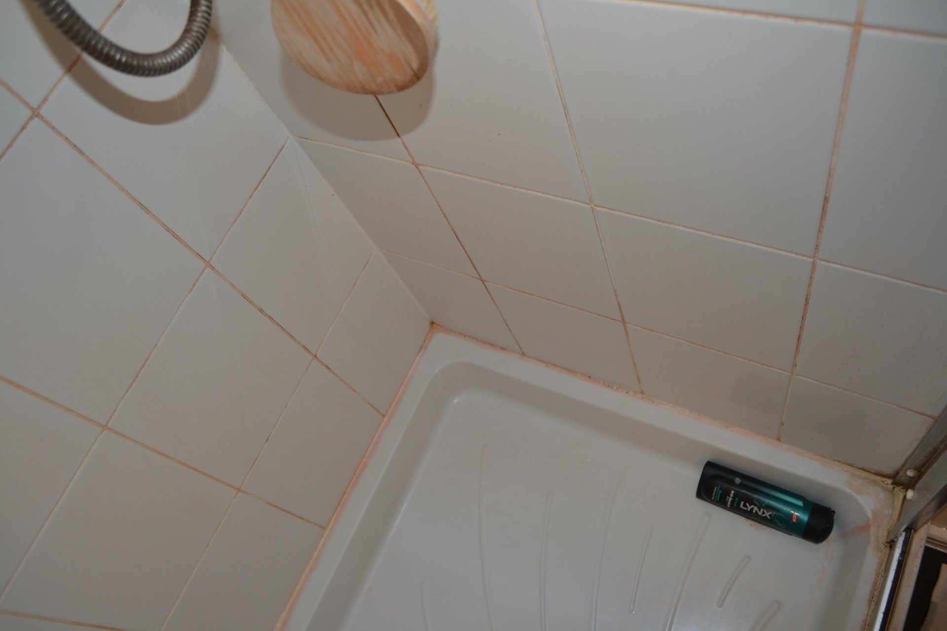 Mouldy discoloured shower cubicle