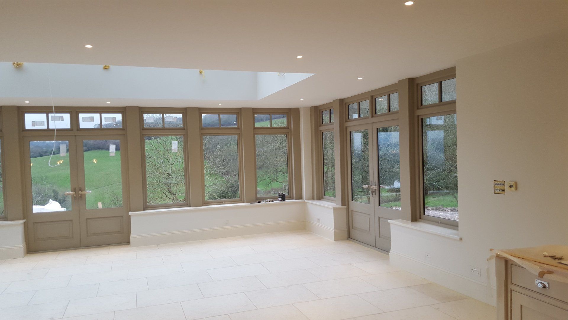 Large dinning room in Cheltenham with hand painted windows and doors. Painted with Paint & Paper Library paint