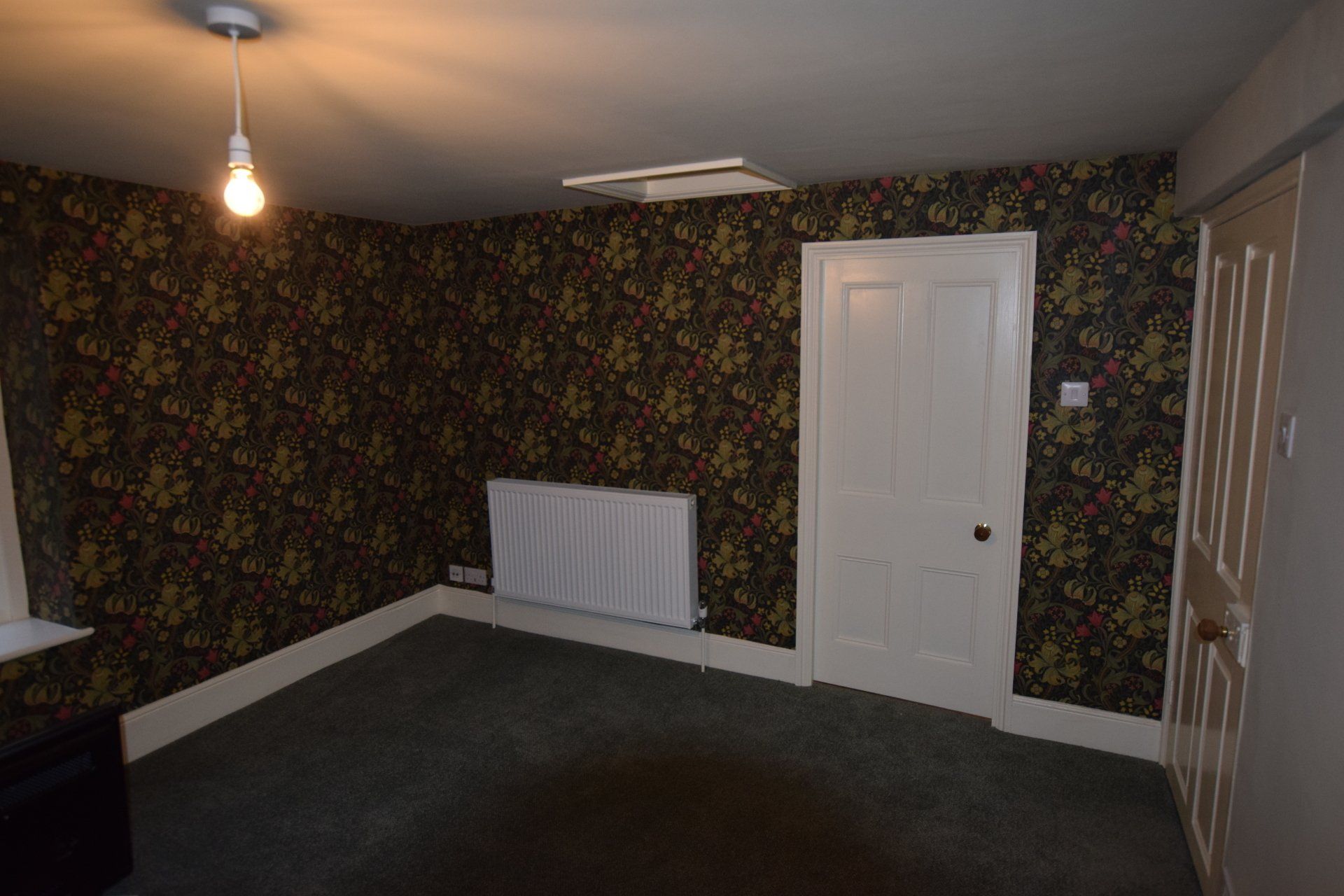 Redecorated room in Gloucestershire, finished with patterned wallpaper