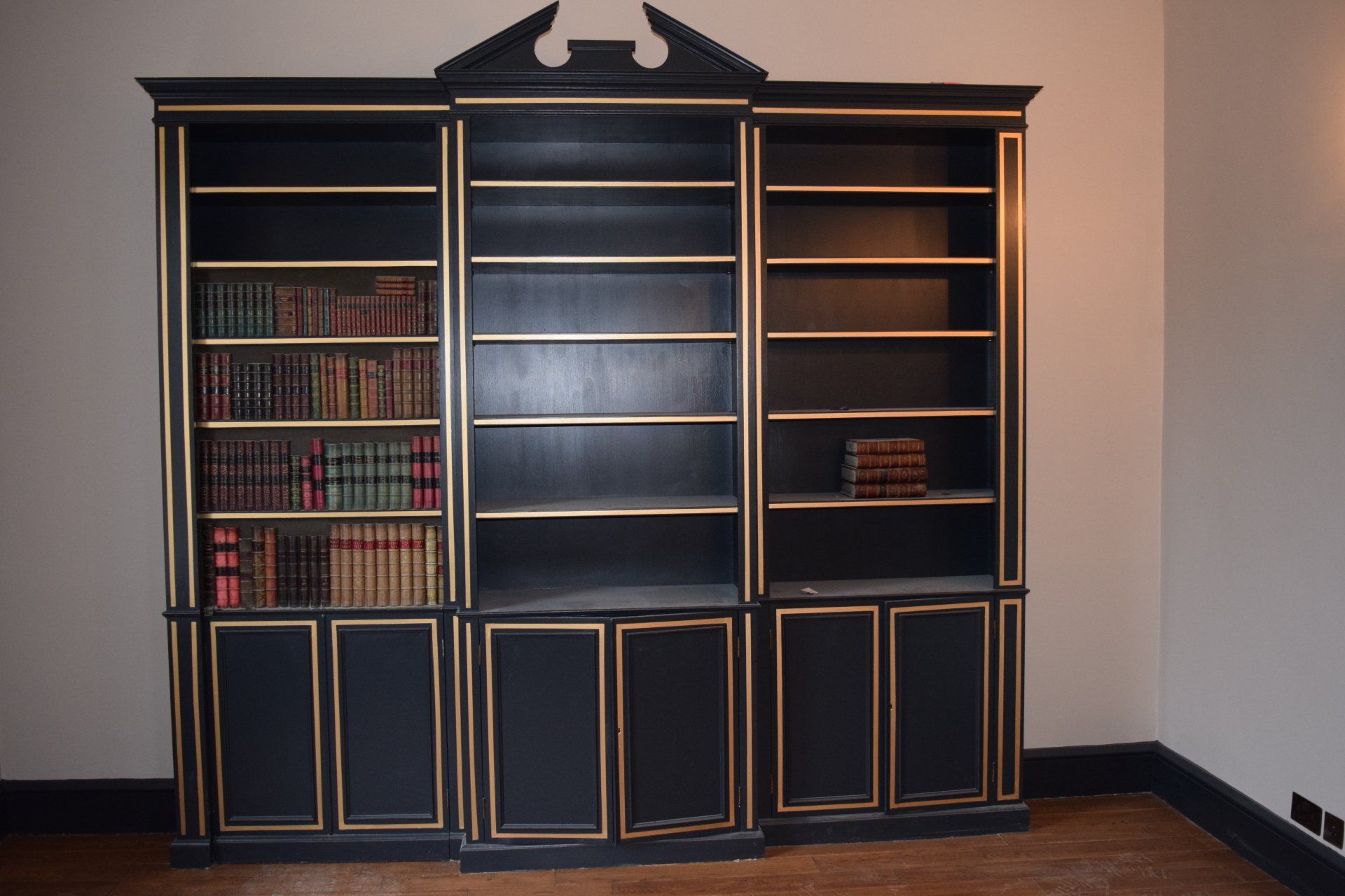 Hand painted book case with secret door in the Cotswold