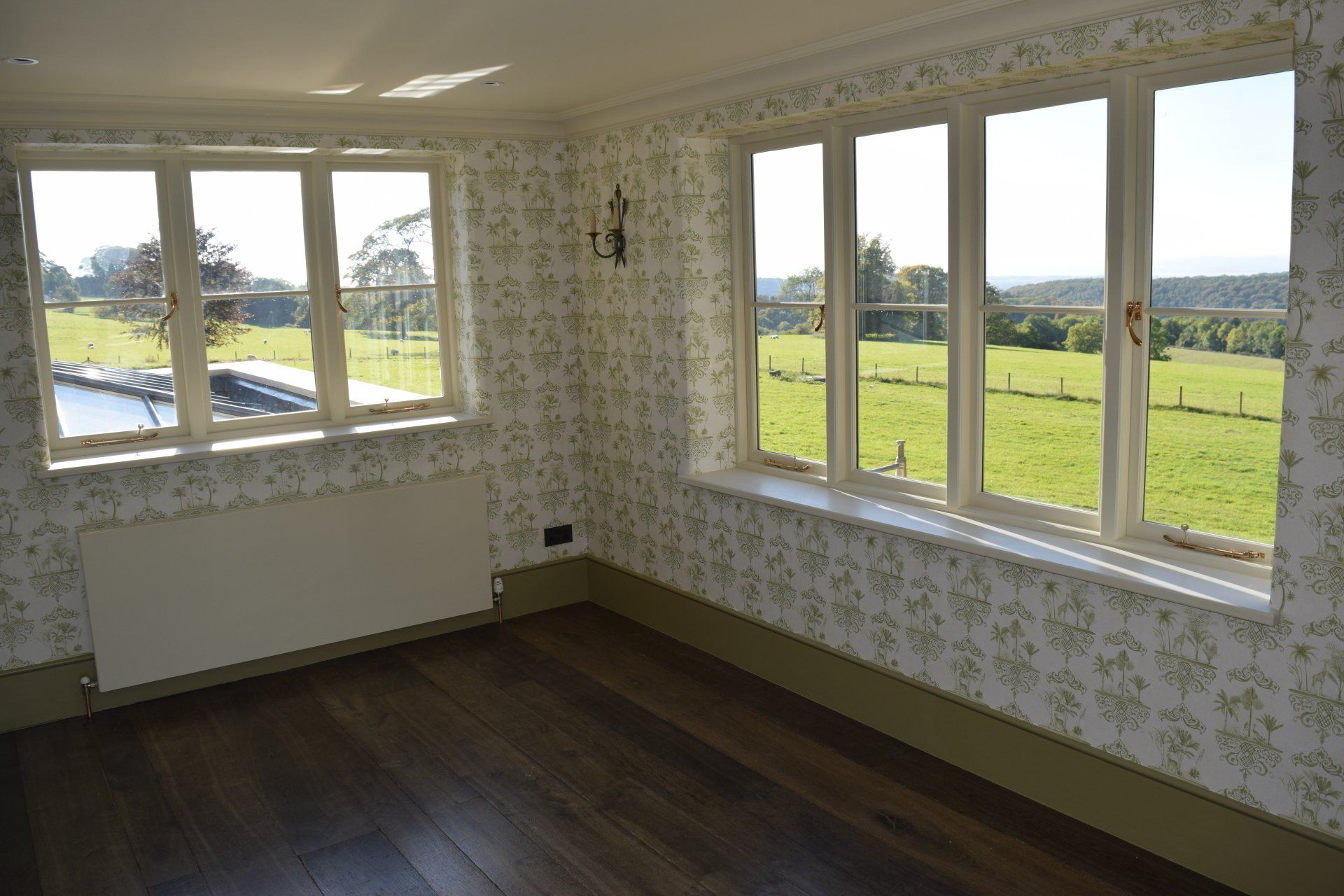 Redecorated bedroom in Cotswold with new patterned wallpaper
