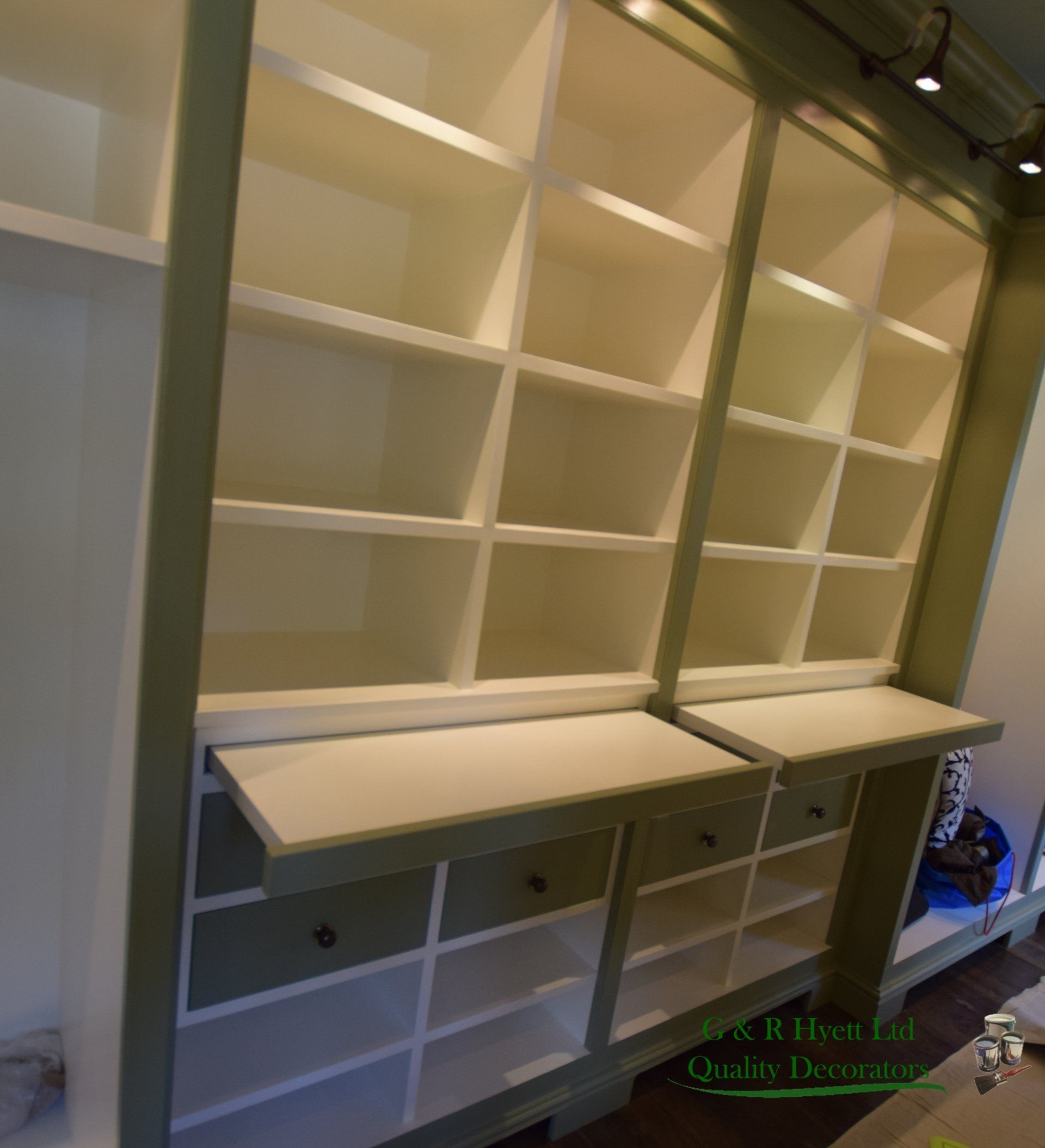 Hand painted shelves in multiple colours in a large property in Gloucestshire