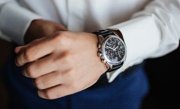 Novelty Watches — Man's Hand Fixing His Watch in Madison, WI Novelty Watches — Man's Hand Fixing His Watch in Madison, WI