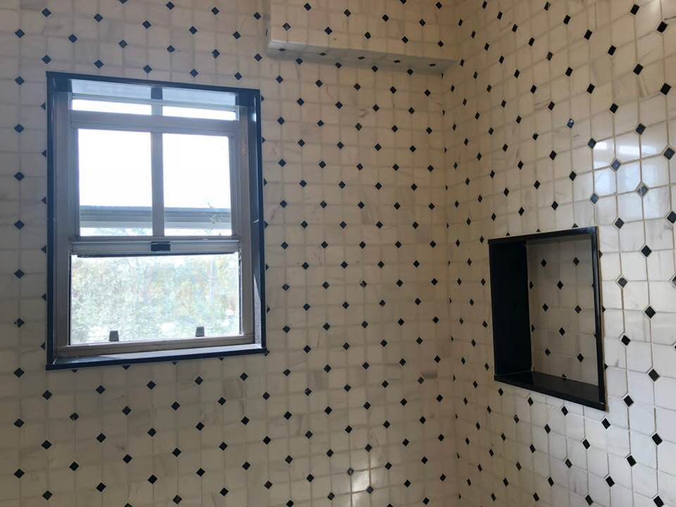 White Tile Wall with Small Black Accents — Palm Harbor, FL — Tarpon Marble, Inc.