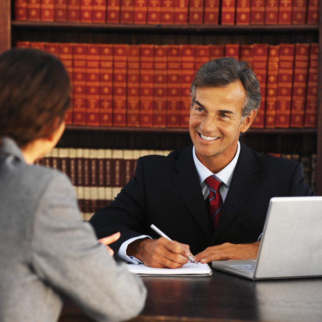 A person meeting with their lawyer