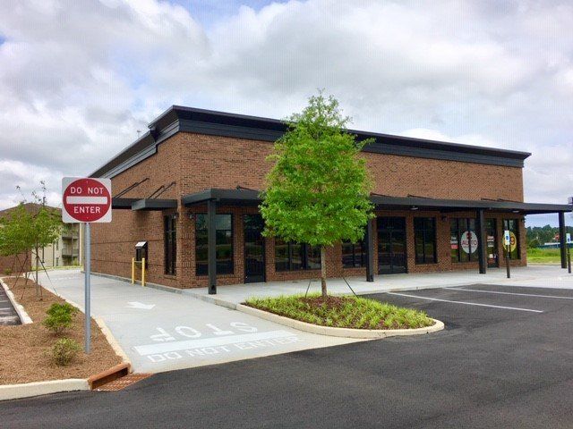 A brick building with a do not enter sign in front of it