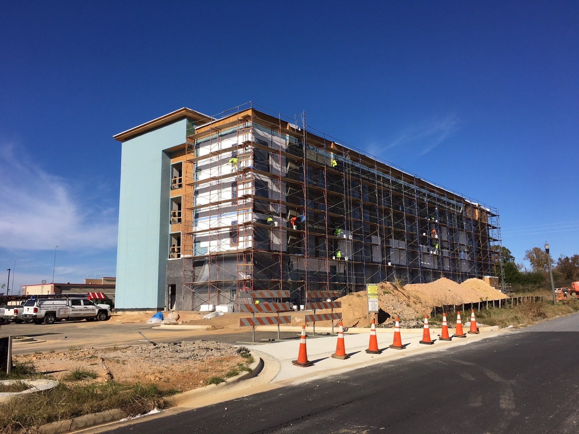 A large building is being built with scaffolding around it.