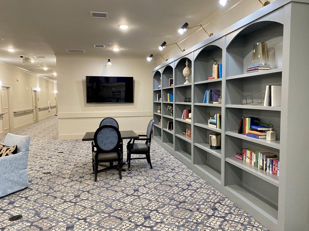 There are a lot of books on the shelves in this room.