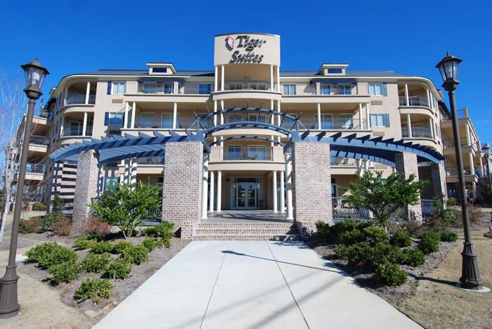 A large building with a sign that says tiger suites