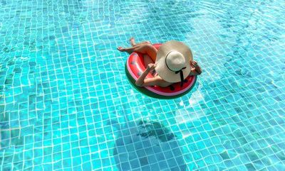 Pools — Lady Floating on Pool in Pueblo, CO Pools — Lady Floating on Pool in Pueblo, CO